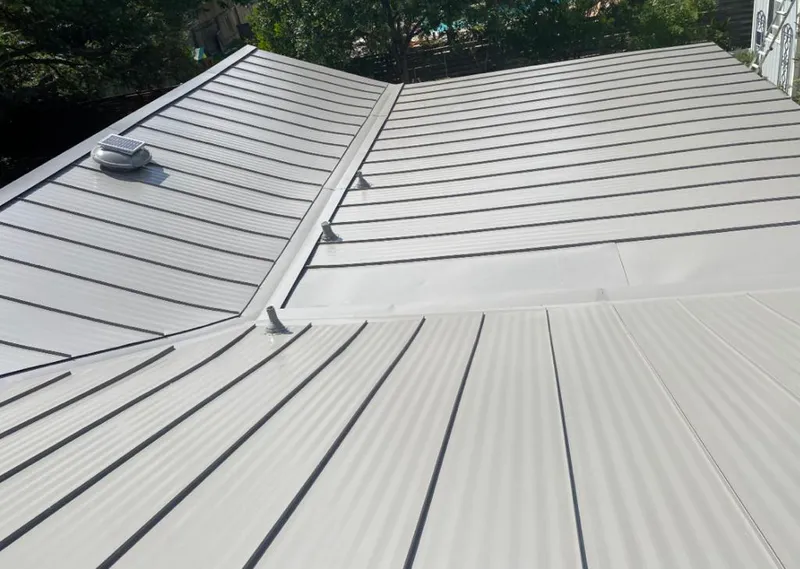 Solar attic fan installed on a metal roof for Roof Ventilation in Walterboro